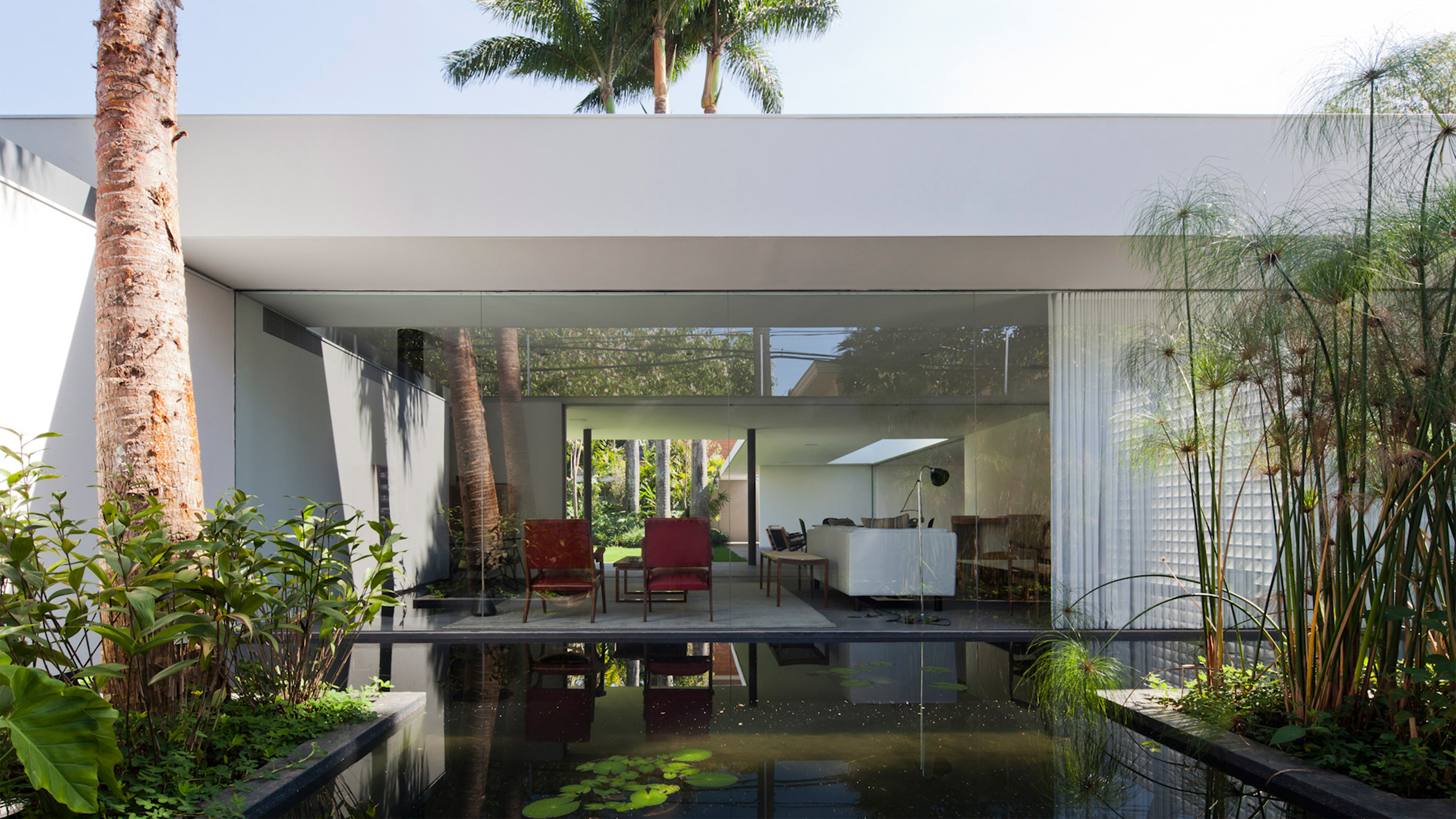 Plant filled Greenery House In Brazil Shines With Modern Floor Lamps
